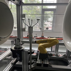 person using crane to move industrial gear box in engineering factory
